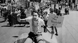 Openly gay American politician, Harvey Milk (1930 - 1978) at the Gay Pride Parade, San Francisco, 23rd June 1978. He is holding a placard that reads: 